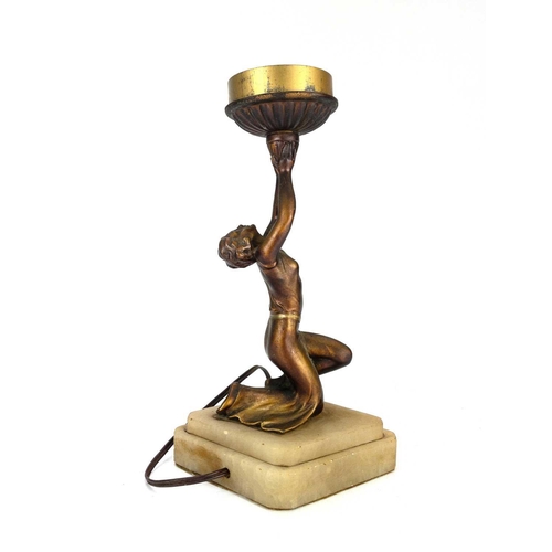 181 - An Art Deco gilt spelter figural table lamp. Modelled as a kneeling female dancer on a stepped diamo... 