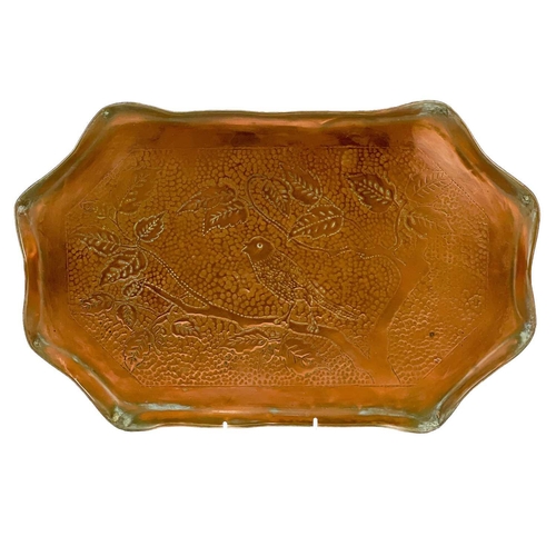 182 - An Arts and Crafts copper tray probably Eustace of Hayle. With repousse and chased decoration of pom... 