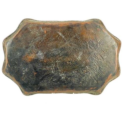 182 - An Arts and Crafts copper tray probably Eustace of Hayle. With repousse and chased decoration of pom... 