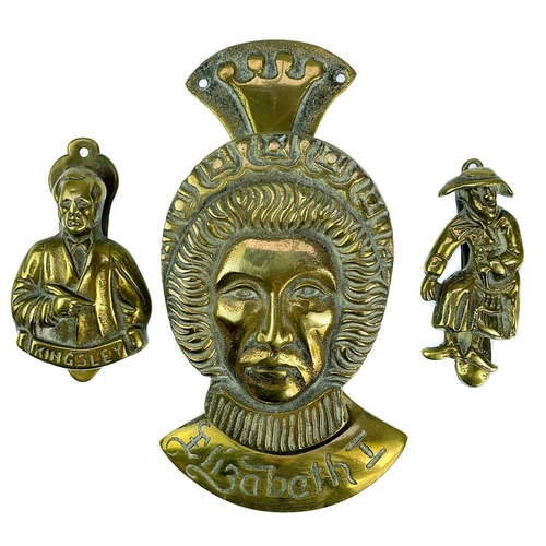 191 - A collection of twenty-eight brass souvenir novelty door knockers. (28).