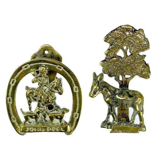 191 - A collection of twenty-eight brass souvenir novelty door knockers. (28).