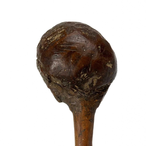 194 - A possible Solomon Islands throwing club. One with carved face, Together with one other throwing clu... 