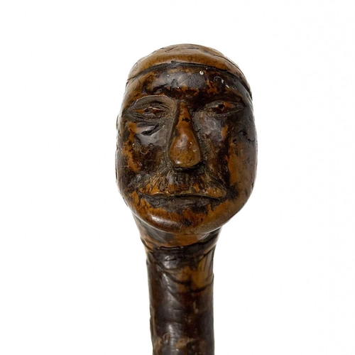 194 - A possible Solomon Islands throwing club. One with carved face, Together with one other throwing clu... 