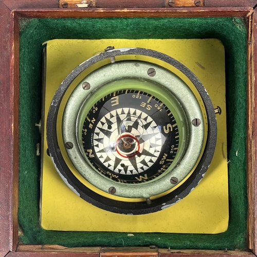 201 - A boxed Domed Compass and spirit level. Late 20th Century, card diameter 8cm.