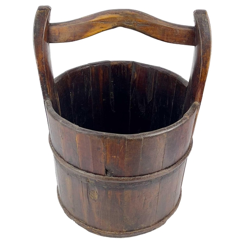 203 - A coopered well bucket. With iron banding, diameter 35.5cm.