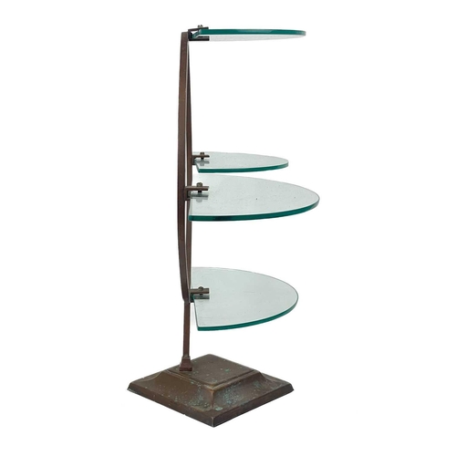 221 - An Art Deco bronze frame glass shelf. With four separate demi lune glass shelves, on a circular bron... 