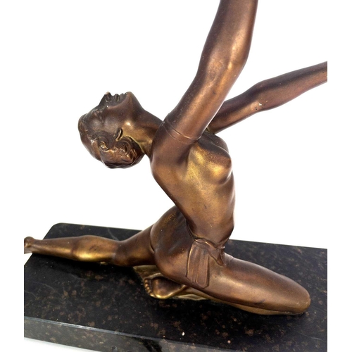 224 - An Art Deco gilt spelter figural table lamp. Modelled as a female dancer on an onyx base, height 35c... 