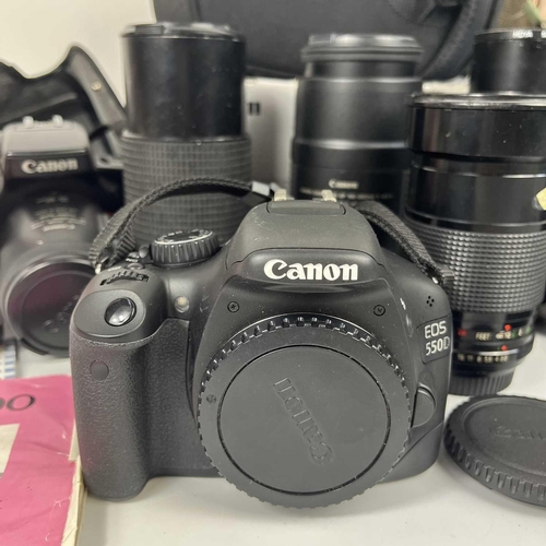 236 - A Canon EOS 550D SLR digital camera body. Together with a Canon EOS 700 SLR camera fitted with a Can... 