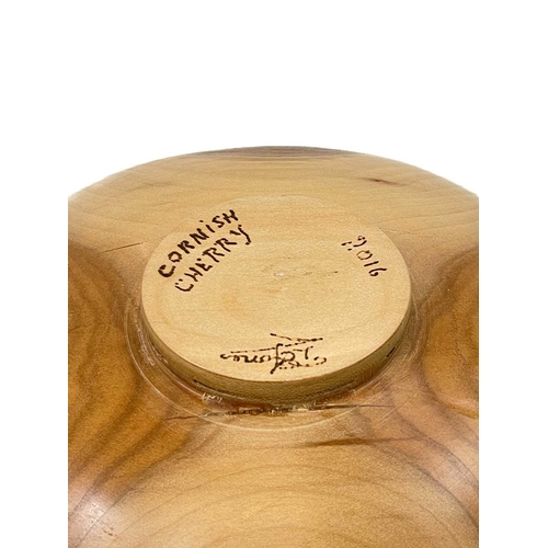 239 - A cherry wood turned bowl with live edge. Signed T E Jones Cornish Cherry 2016, diameter 22cm.