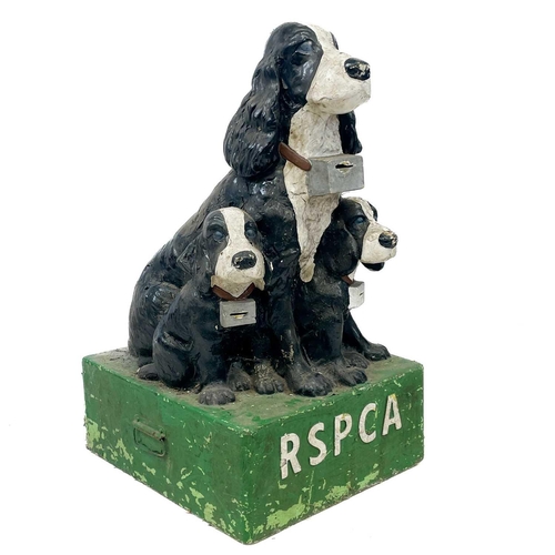 240 - A composition freestanding RSPCA charity collection box. Moulded as a spaniel and two pups, on a gre... 