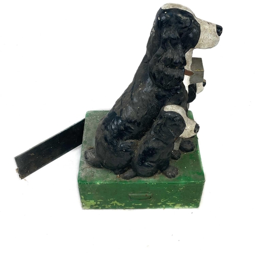 240 - A composition freestanding RSPCA charity collection box. Moulded as a spaniel and two pups, on a gre... 