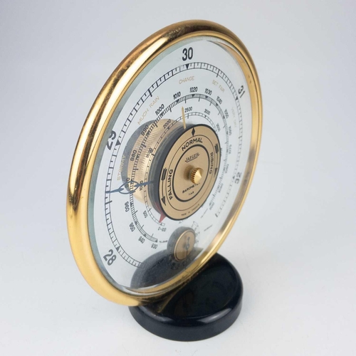 245 - A Jaeger desk top barometer. Of circular form, diameter 17cm. This barometer appears to be in workin... 