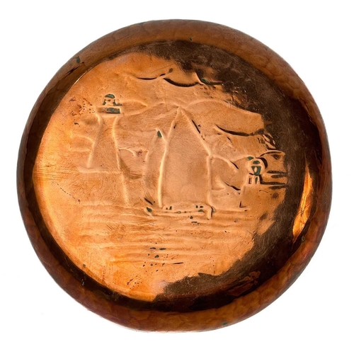 246 - A Newlyn copper circular pin dish with chased decoration of St Michael's Mount. Stamped Newlyn, diam... 