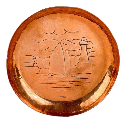 246 - A Newlyn copper circular pin dish with chased decoration of St Michael's Mount. Stamped Newlyn, diam... 