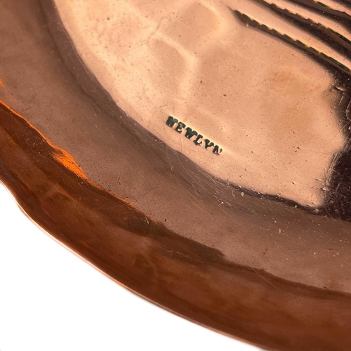 246 - A Newlyn copper circular pin dish with chased decoration of St Michael's Mount. Stamped Newlyn, diam... 