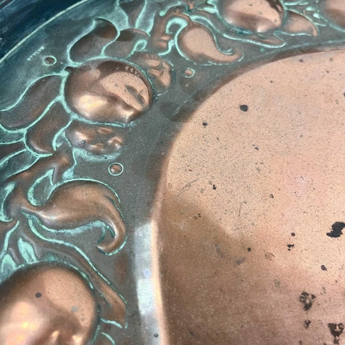 247 - A Newlyn copper oval galleried tray. With twin handles, repousse decorated to the border with a band... 