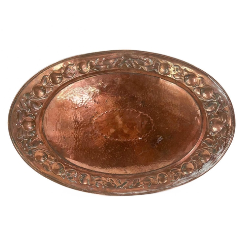 247 - A Newlyn copper oval galleried tray. With twin handles, repousse decorated to the border with a band... 