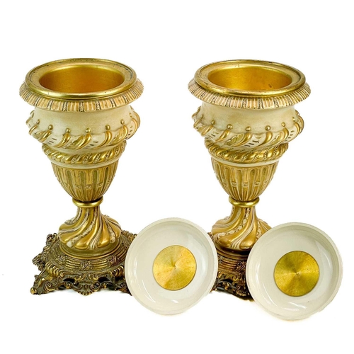 248 - A pair of Continental porcelain and gilt metal mounted urns and covers. Circa 1900, each with a crea... 