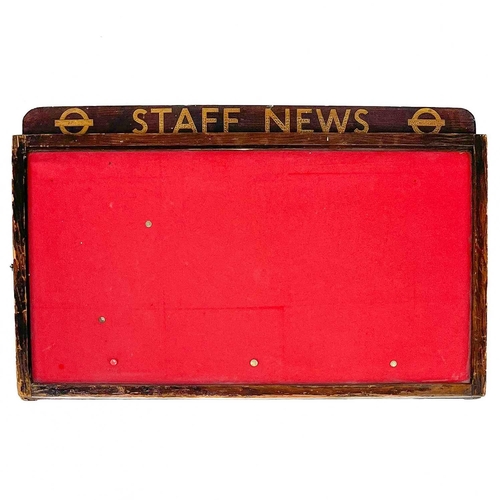 252 - A vintage London Underground 'Staff News' notice board. With painted top and hinged glazed door, hei... 