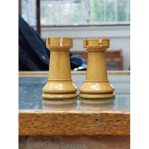 266 - A Jacques style Staunton pattern set Chess. In boxwood and ebony, red crown stamps to a rook and a k... 