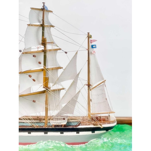 268 - A scratch built model of a Victorian Clipper ship. Under a glazed case, overall height 45cm width 68... 