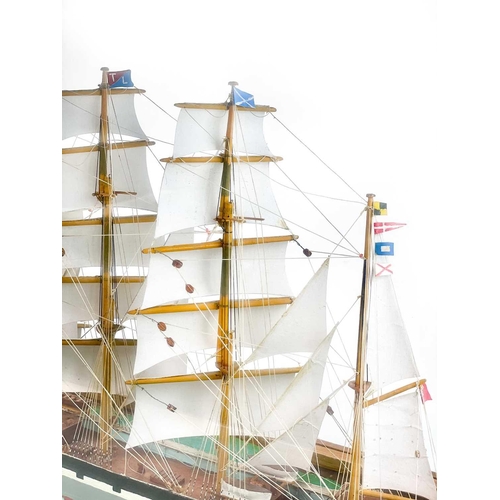 268 - A scratch built model of a Victorian Clipper ship. Under a glazed case, overall height 45cm width 68... 