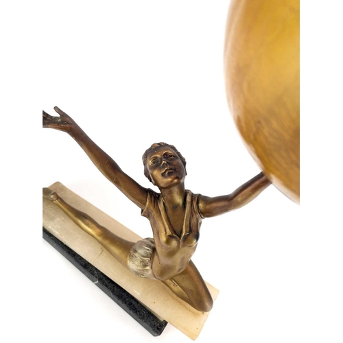 269 - An Art Deco gilt spelter figural table lamp. Possibly Lorenzl modelled as a female dancer on an onyx... 