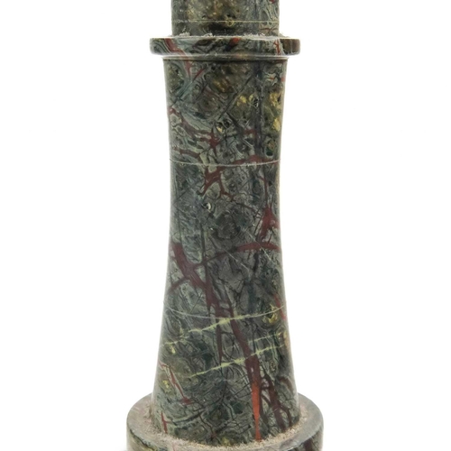 27 - A Cornish serpentine lighthouse table lamp. On a rocky base, height 27cm.