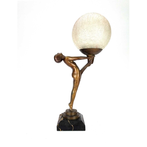 281 - Max Le Verrier (1891-1973) An Art Deco gilt bronze figural table lamp with a crizzled glass shade on... 