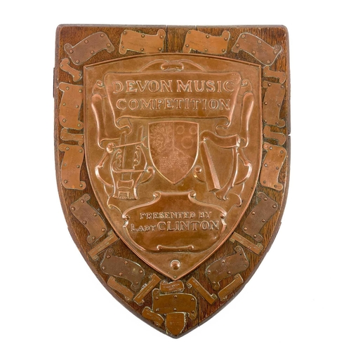 284 - A Newlyn copper trophy shield for the Devon Music Competition. Presented by Lady Clinton, backed ont... 