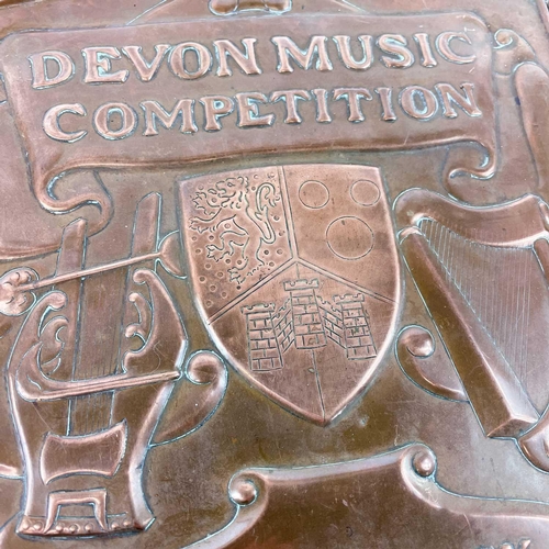 284 - A Newlyn copper trophy shield for the Devon Music Competition. Presented by Lady Clinton, backed ont... 