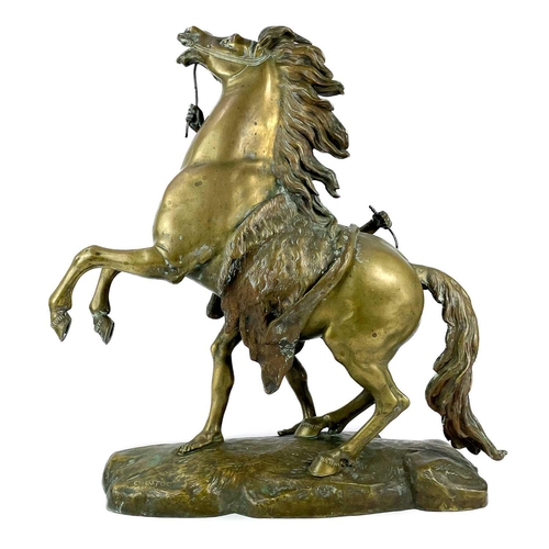 285 - A substantial pair of brass Marly horses, After Coustou. Each with stamped signature on the rockwork... 