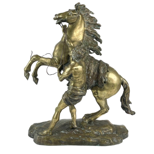 285 - A substantial pair of brass Marly horses, After Coustou. Each with stamped signature on the rockwork... 