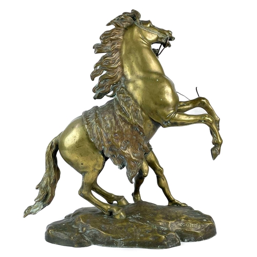 285 - A substantial pair of brass Marly horses, After Coustou. Each with stamped signature on the rockwork... 