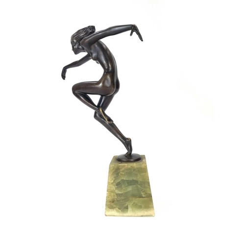 289 - Josef Lorenzl (Austrian-1852-1950). A bronze figure of a female dancer with flowing hair on an onyx ... 