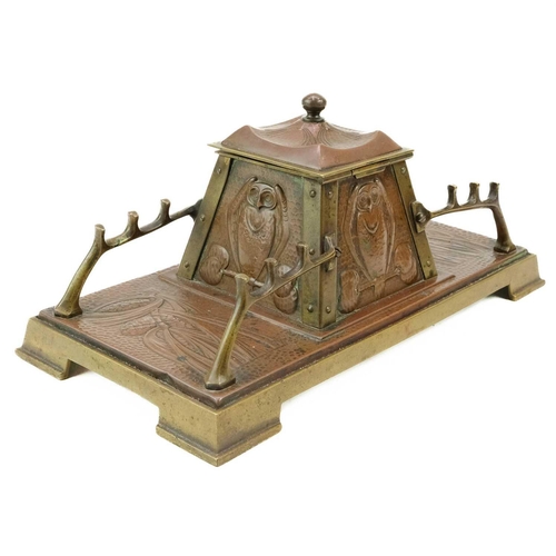 295 - A Jugendstil inspired brass and copper inkwell or Standish. Probably German circa 1900, the tapered ... 