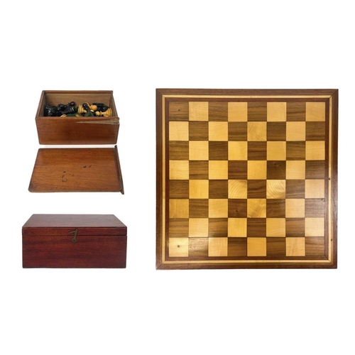 30 - A boxwood and ebony chess set. In a mahogany box, another chess set, and an inlaid chess board.