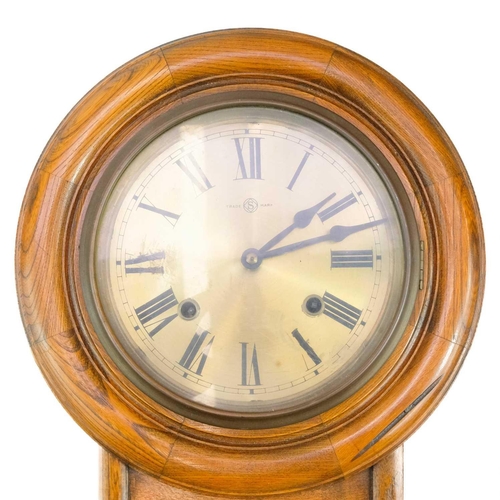 319 - A Regulator A drop dial wall clock. With a circular brass dial in an elm case, height 56cm, diameter... 