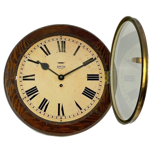 320 - A Smith's eight-day circular wall clock. Diameter 39cm.