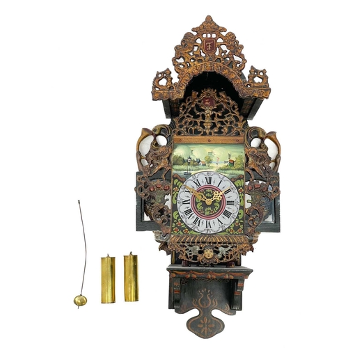 322 - A Dutch wall clock. 20th century, in the 18th century style, with gilt metal painted crest and paint... 