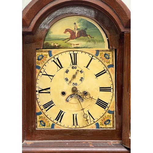 324 - A Victorian eight-day longcase clock. Contained in a scumbled pine case, the arch painted with a hun... 