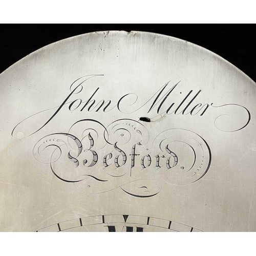 327 - An oak longcase clock The arched silvered dial signed John Miller Bedford, with an eight-day movemen... 