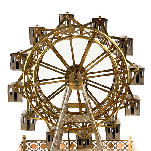 333 - An unusual Wurtemberg Ferris wheel automaton timepiece. Circa 1900, in pressed silvered and gilt met... 