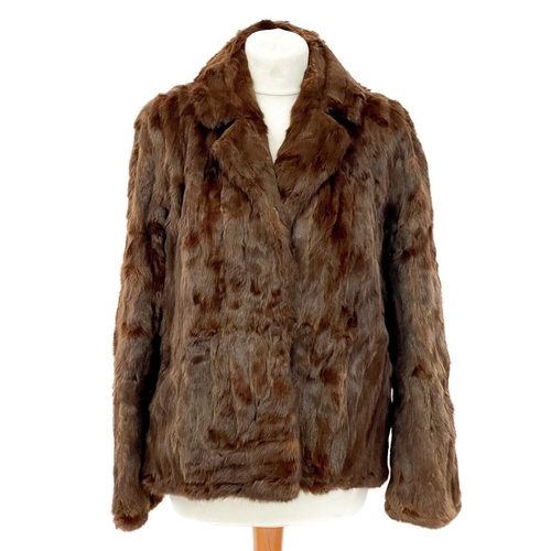 336 - A velvet fur trimmed jacket. Together with a stole and a fur coat.