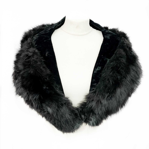 336 - A velvet fur trimmed jacket. Together with a stole and a fur coat.