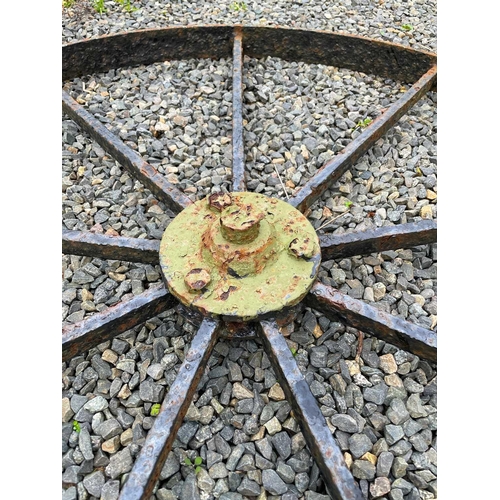 346 - A late wrought iron implement/cart wheel. Diameter 106cm.