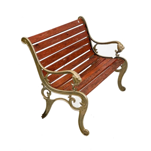 360 - A pair of cast iron garden benches. With cast iron bench ends painted gold and lion mask detail, wid... 