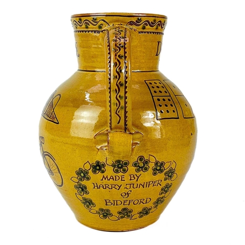 403 - A Harry Juniper Bideford north Devon studio pottery jug. With sgraffito decoration, Height 21.5cm.