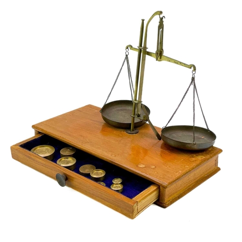 41 - A set of kitchen balance scales. Together with a set of postage scales contained in a Fortnum and ma... 