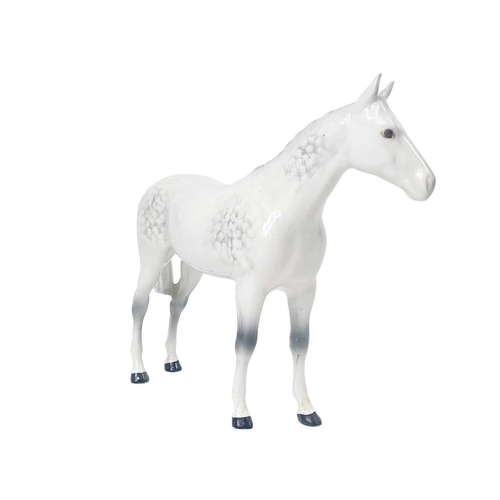 413 - A Beswick Pottery dappled grey horse. Label and stamp marks, height 20.5cm